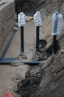 The three four inch pressure lines from each drain to the filter system are connected 